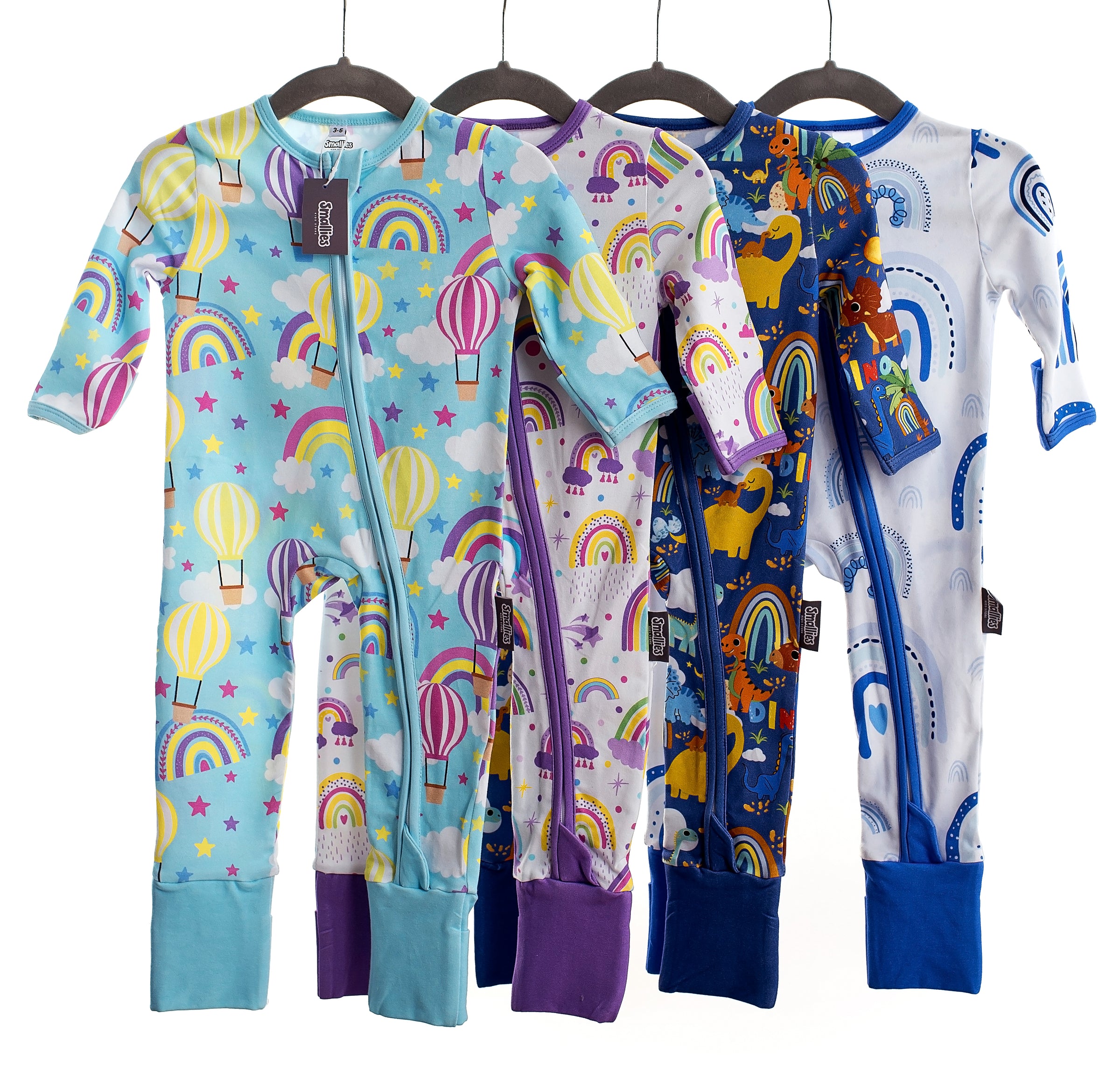 Children wearing colourful zipped sleepsuits