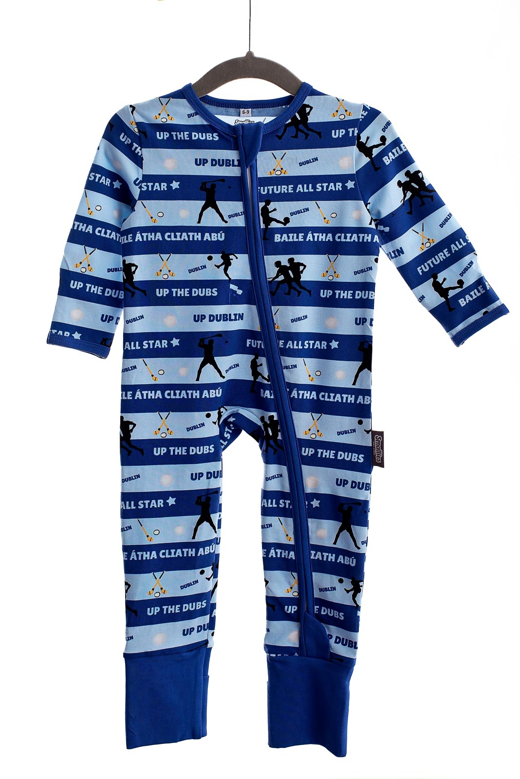 Children wearing colourful zipped sleepsuits