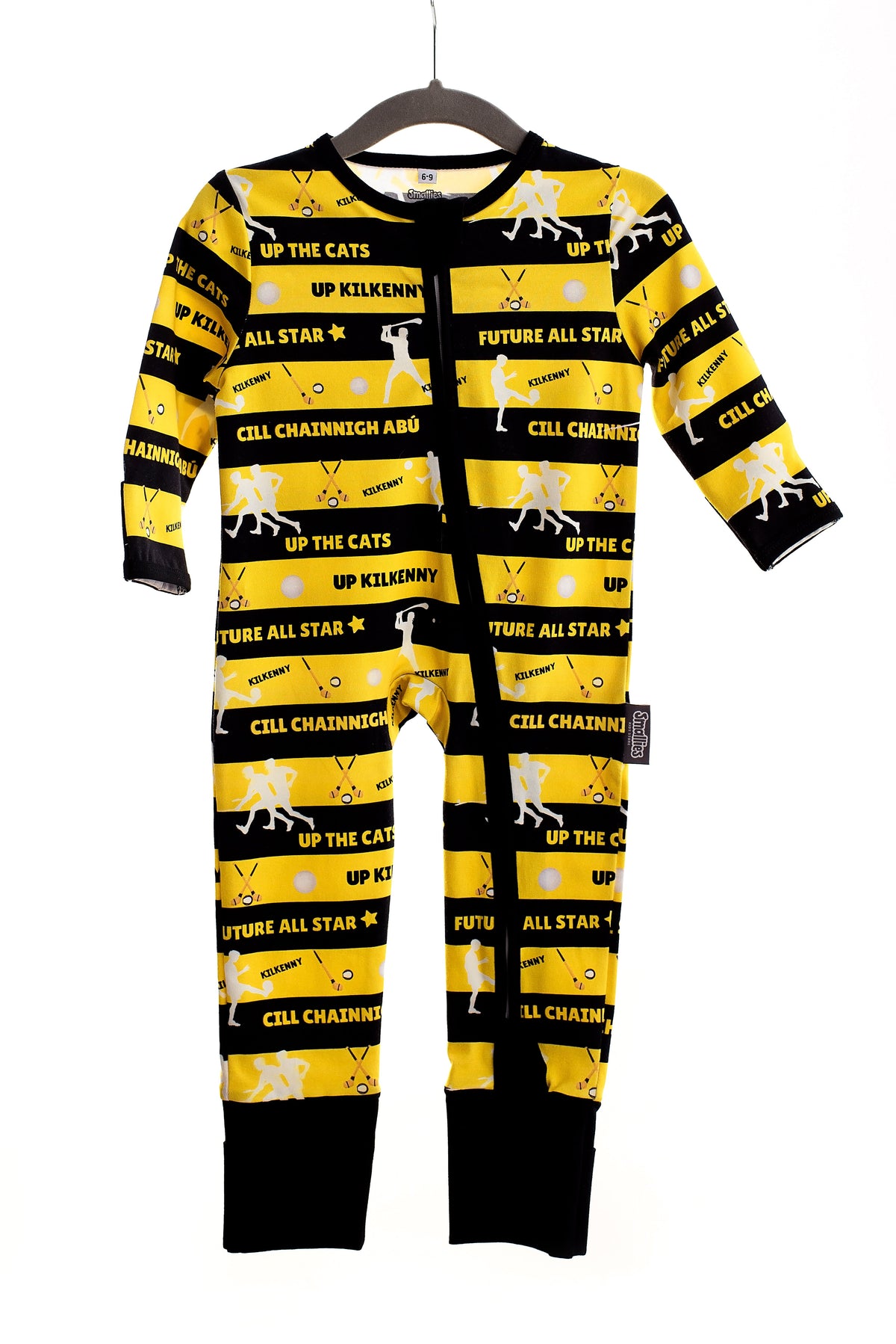 Children wearing colourful zipped sleepsuits