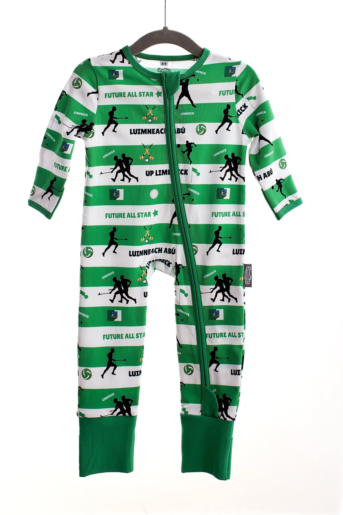 Children wearing colourful zipped sleepsuits