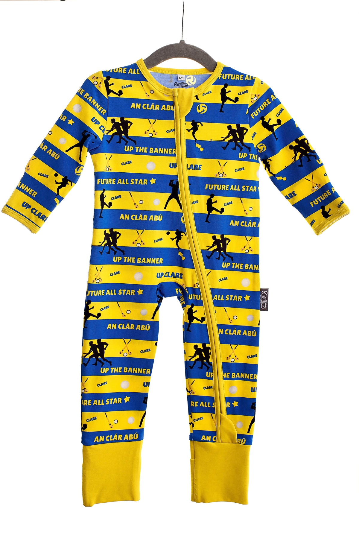 Children wearing colourful zipped sleepsuits